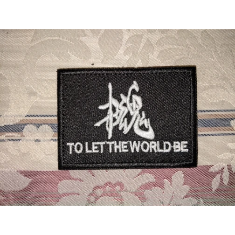 to let the world be patch photo review