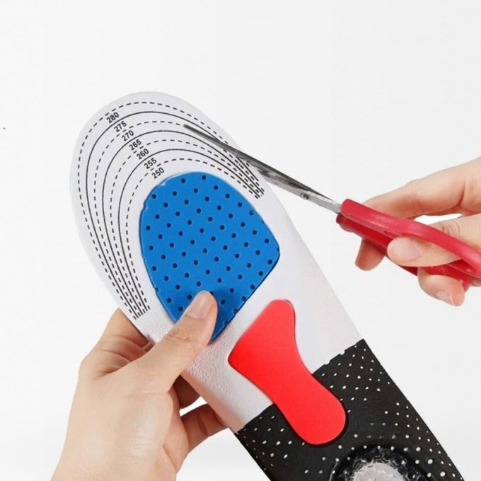 Shock absorbing insoles with arch support